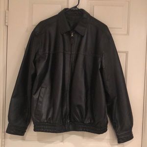 Thick, lined Black Jacket/Collared with adjustable snapped sleeves